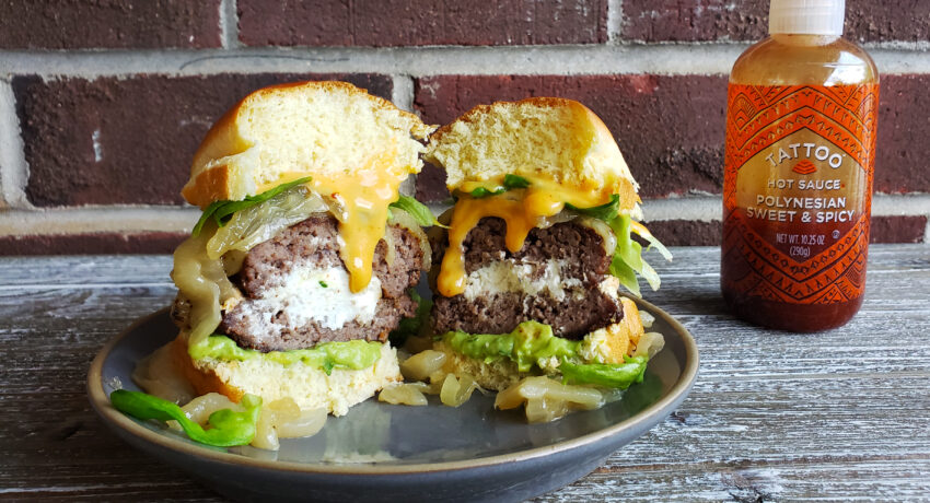 Goat Cheese Stuffed Burgers with Guacamole and Caramelized Onions